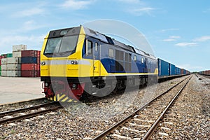 Cargo train platform with freight train container at depot use f