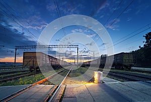 Cargo train platform at night. Railroad in Ukraine. Railway stat