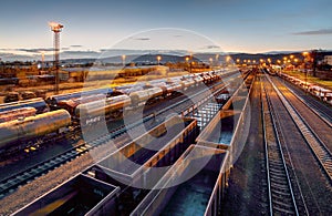 Cargo train platform at sunset with container