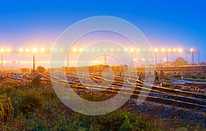 Cargo train platform at sunset with container