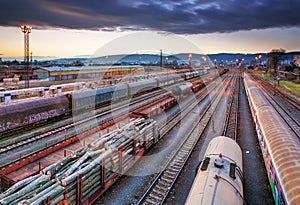 Cargo train platform at sunset with container