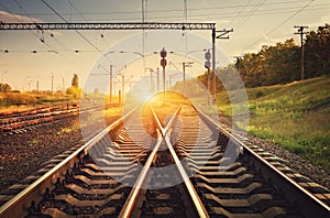 Cargo train platform at sunset. Railroad. Railway station