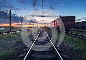 Cargo train platform at sunset. Railroad in Ukraine. Railway sta