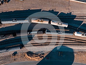 Cargo train waiting to be filled in an oil refineries.