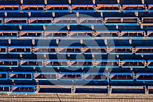 Cargo trains. Aerial view of colorful freight trains on the railway station. Wagons with goods on railroad.Aerial view