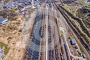 Cargo trains. Aerial view of colorful freight trains on the railway station. Wagons with goods on railroad.Aerial view