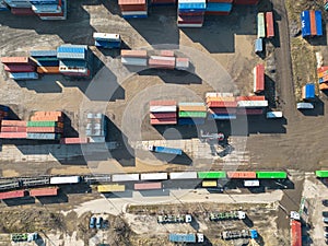 Cargo trains close-up. Aerial view of colorful freight trains on the railway station. Wagons with goods on railroad. Heavy
