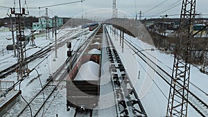 Cargo trains in close-up. View from the bridge of a moving freight train at the railway station.