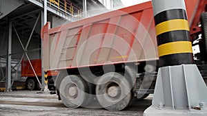 Cargo Transportation - Two red truck in the warehouse. Storage and freight terminal. Industrial vertical background