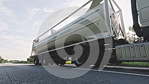 Cargo truck with fuel diesel cargo trailer driving on a highway