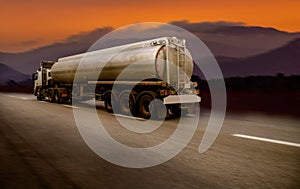 Cargo truck with heavy container speed on high way road to delivery logistic business with sun sky background.