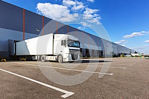 Cargo truck at warehouse building