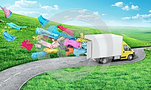 A cargo van rides along the road and clothes fly out of it on a beautiful nature background. Delivery