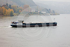 Cargo vessel navigating river Rhine Germany