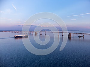 Cargo Vessel Passing Under The Chesapeake Bay Bridge