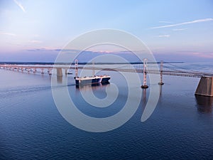 Cargo Vessel Passing Under The Chesapeake Bay Bridge