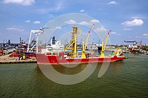 Cargo vessel in sea port Rotterdam, Netherlands.