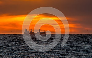 Cargo Vessel In Sunset