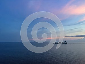 Cargo vessel transits calm waters