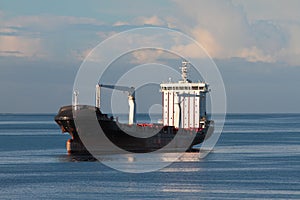 Cargoship on raid in sea photo