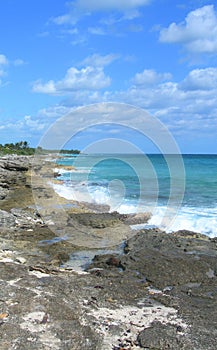 Caribbean beach background with lava rocks