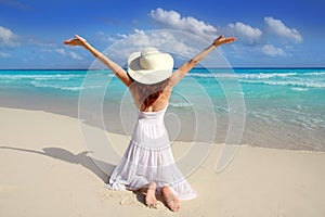 Caribbean beach woman rear on knees open arms