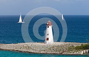 Caribbean Lighthouse With Sail