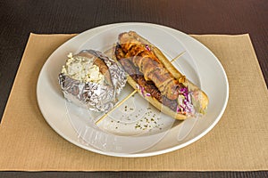 Caribbean sausage hot dog with fried ripe plantain and baked potato stuffed