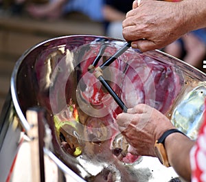 Caribbean Steel pan drum player with sticks