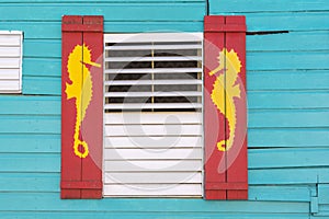 Caribbean style window with sea horse design