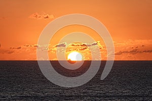Caribbean sunset in ocean from cruise ship