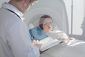 Caring doctor analyzing medical results photo