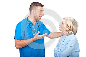 Caring doctor give explanation to senior woman