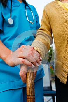 Caring Doctor and Senior Lady Hands