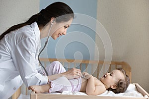 Caring female doctor examine small baby in hospital