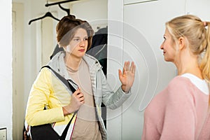 Caring mother send teenager son to school