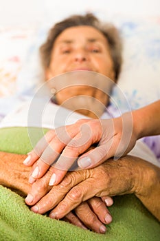 Caring Nurse Holding Hands photo