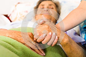 Caring Nurse Holding Hands photo