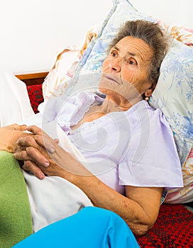 Caring Nurse Holding Hands