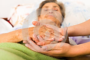 Caring Nurse Holding Hands photo