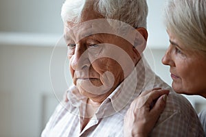 Caring old wife support caress sad senior husband