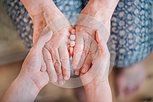 Caring for the older generation. Care for the elderly. Caring for elders about parents, grandparents. Hands in hands photo