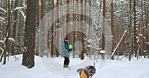 The caring owner of the dog walks with her for several hours in the forest