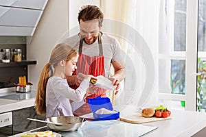 Caring parent preparing breakfast for child