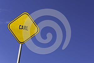 Carl - yellow sign with blue sky background