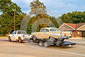 Carleton MI - September 17, 2022: 57 Chevy on a trailer being hauled by pickup