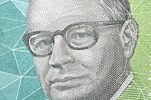 Carlos Lleras Restrepo a closeup portrait from Colombian money