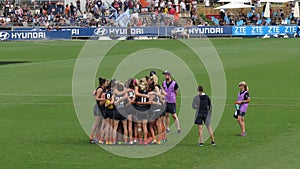 Carlton players together in a huddle before starting a game against Melbourne at Ikon Park Stadium