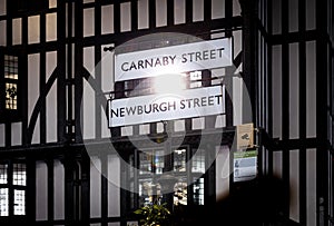 Carnaby street and Newburgh street signs in Soho, London