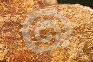 Carnallite mineral close-up. Mineral orange color, background and texture